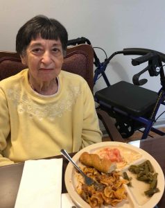 Angels for the Elderly memory care resident with meal in Montgomery, AL