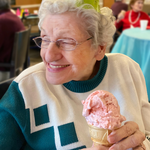 Fairview Park memory care resident enjoying ice cream in Simpsonville, SC