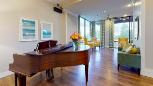 Lake Howard Heights | Piano and chairs in lobby