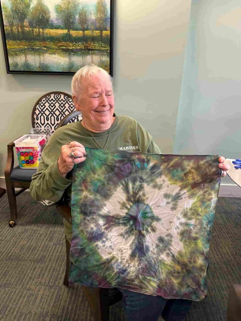 Lake Howard Heights resident enjoying a creative tie-dye activity in Winter Haven, FL.