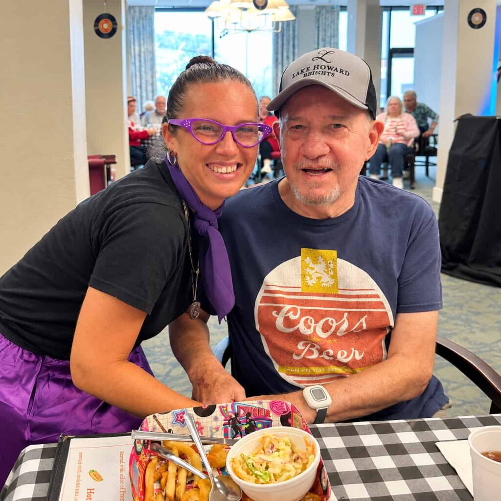 Lake Howard Heights resident enjoying a social dining event with a team member in Winter Haven, FL.