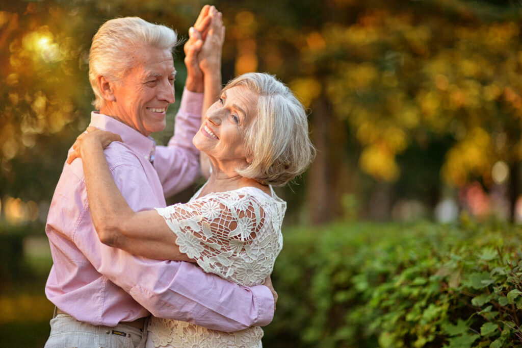 Atlas Senior Living | Happy senior couple dancing outside