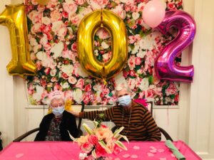 Atlas Senior Living | Clara with another resident on her birthday