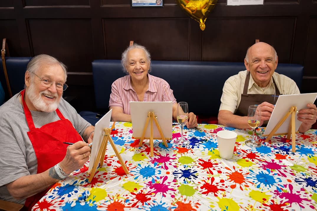 Seniors painting in a community Alpharetta GA