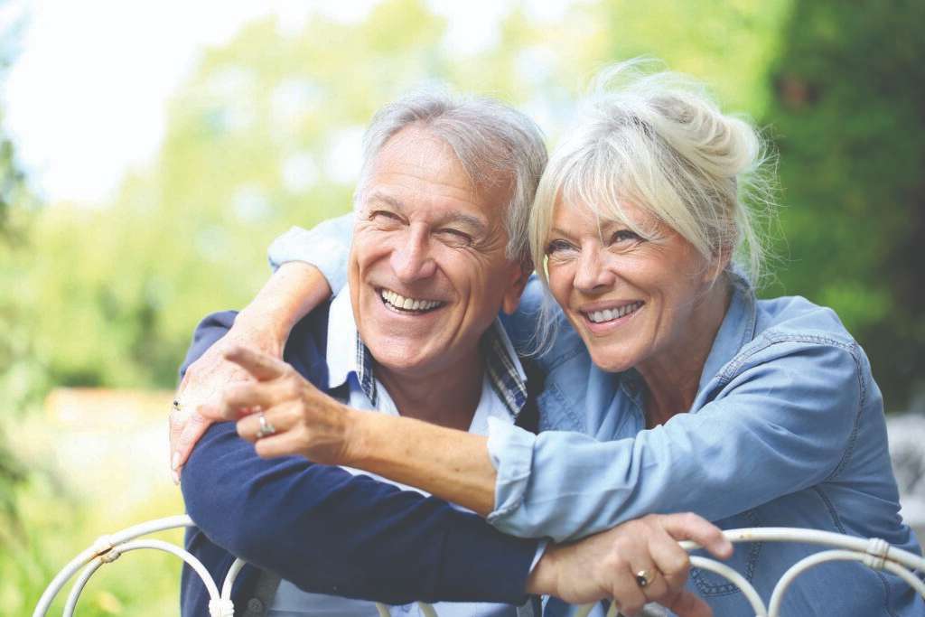 Legacy Ridge at Bookstone | Senior couple hugging outdoors