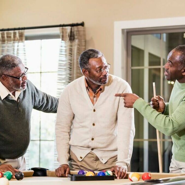 Legacy Ridge at Bookstone | Senior men playing pool