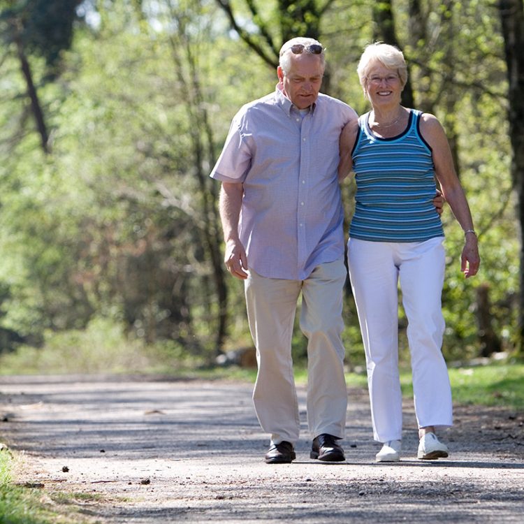 Legacy Ridge at Sandy Plains | Lovely senior couple strolling through the park