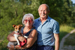 Atlas Senior Living | Senior couple with dog on trail