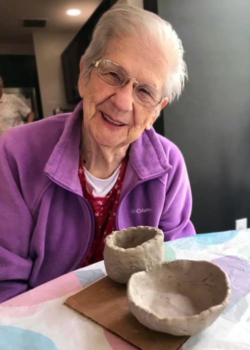 Madison Heights Evans | Elder woman and pottery