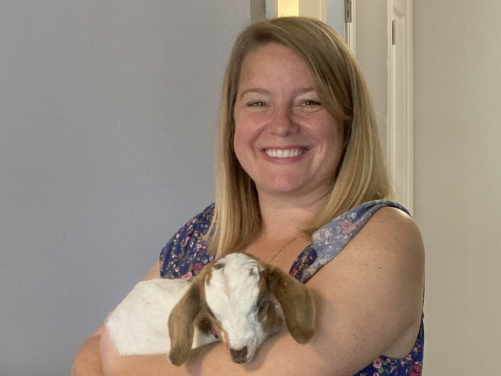 Madison Heights Evans | Woman with baby goat