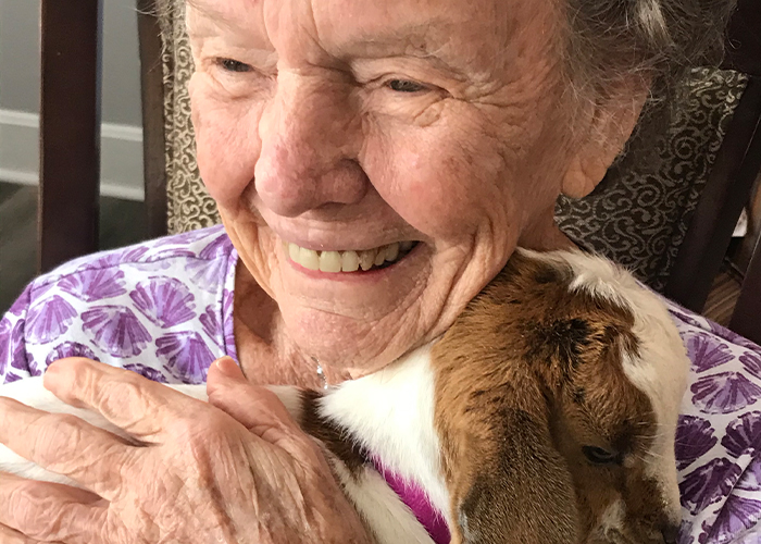 Madison Heights Evans | Resident holding Baby Goat