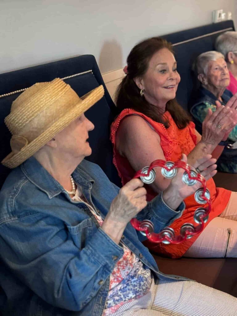 Residents participating in a group activity at Monark Grove Greystone, a senior living community in Birmingham, AL.