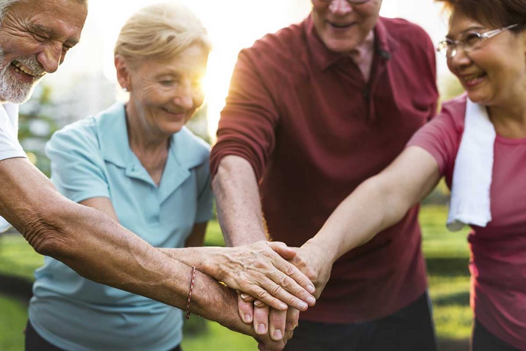 The Atrium at Boca Raton | Seniors holding hands