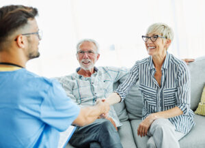 Atlas Senior Living | Senior couple meeting caregiver