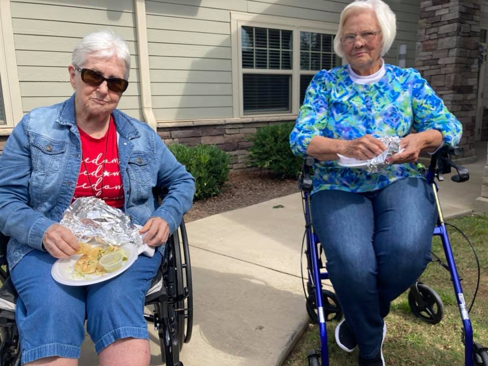 Atlas Senior Living | Residents eating tacos