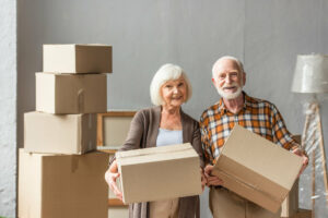 The Goldton at Athens | Happy seniors carrying boxes