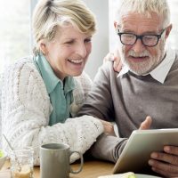 The Goldton at Southaven | Senior couple using tablet