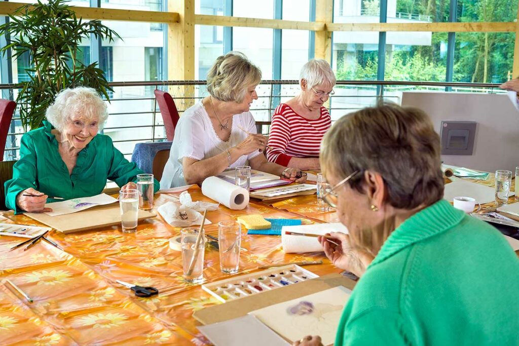 Atlas Senior Living | Senior women in painting class