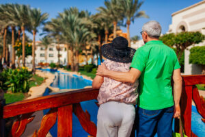 The Goldton at St. Petersburg | Senior couple standing on a bridge and looking out at the view of the water