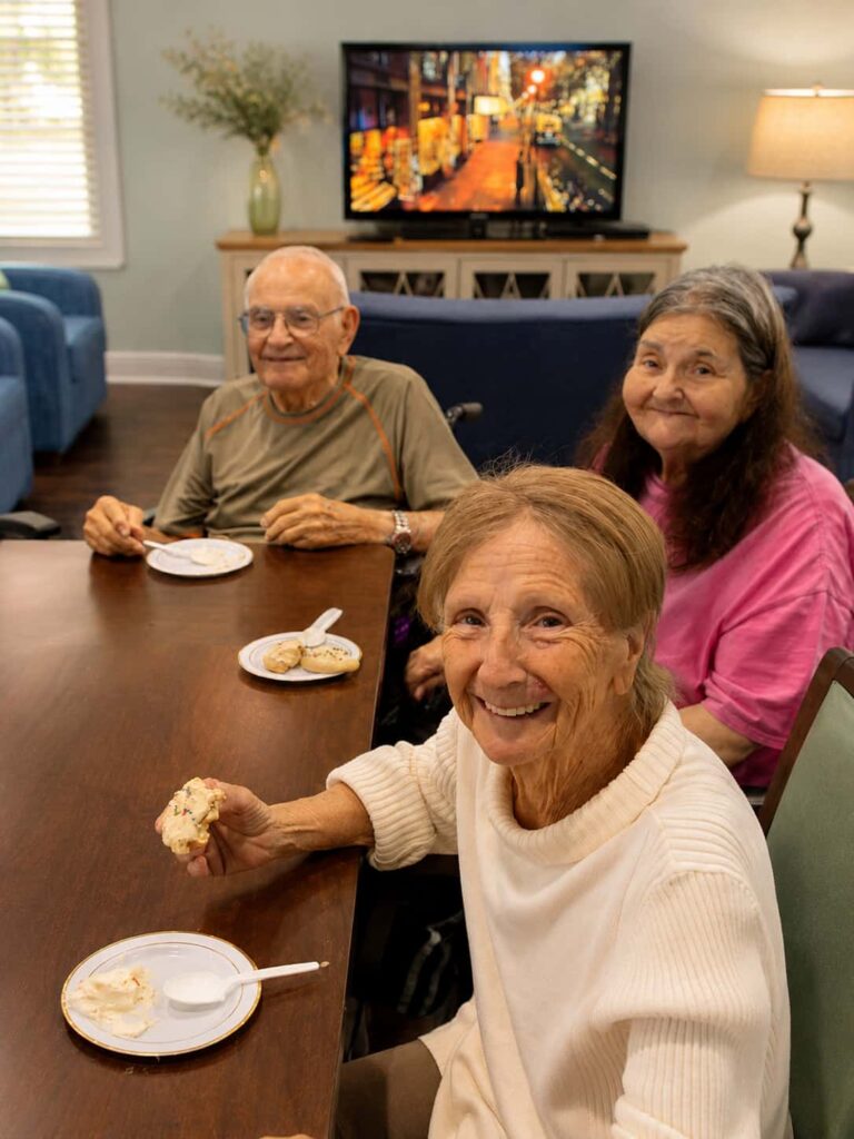 Residents enjoying a social activity at The Goldton at St. Petersburg Memory Care in Florida