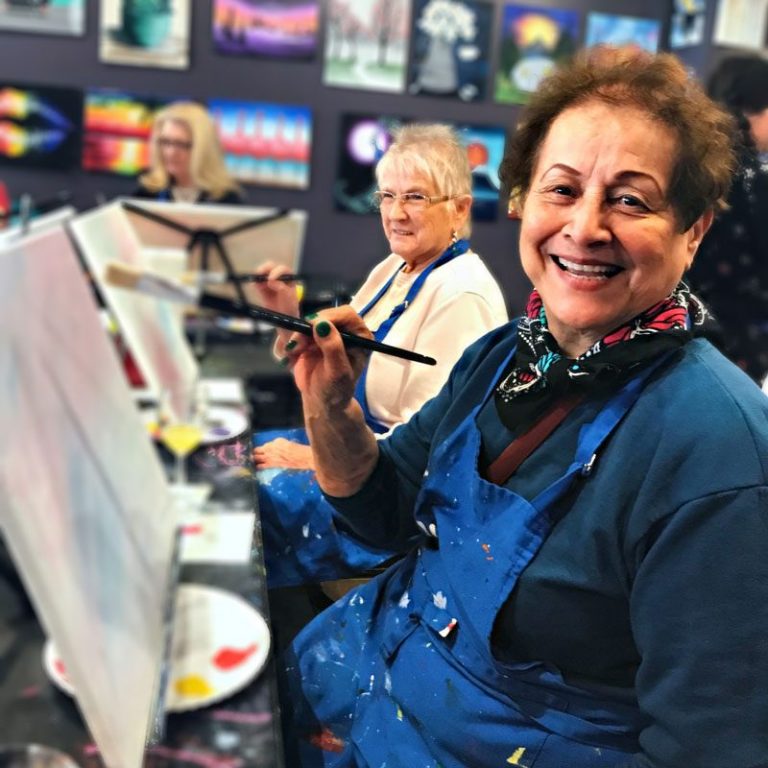 Atlas Senior Living | Senior women painting at an art studio