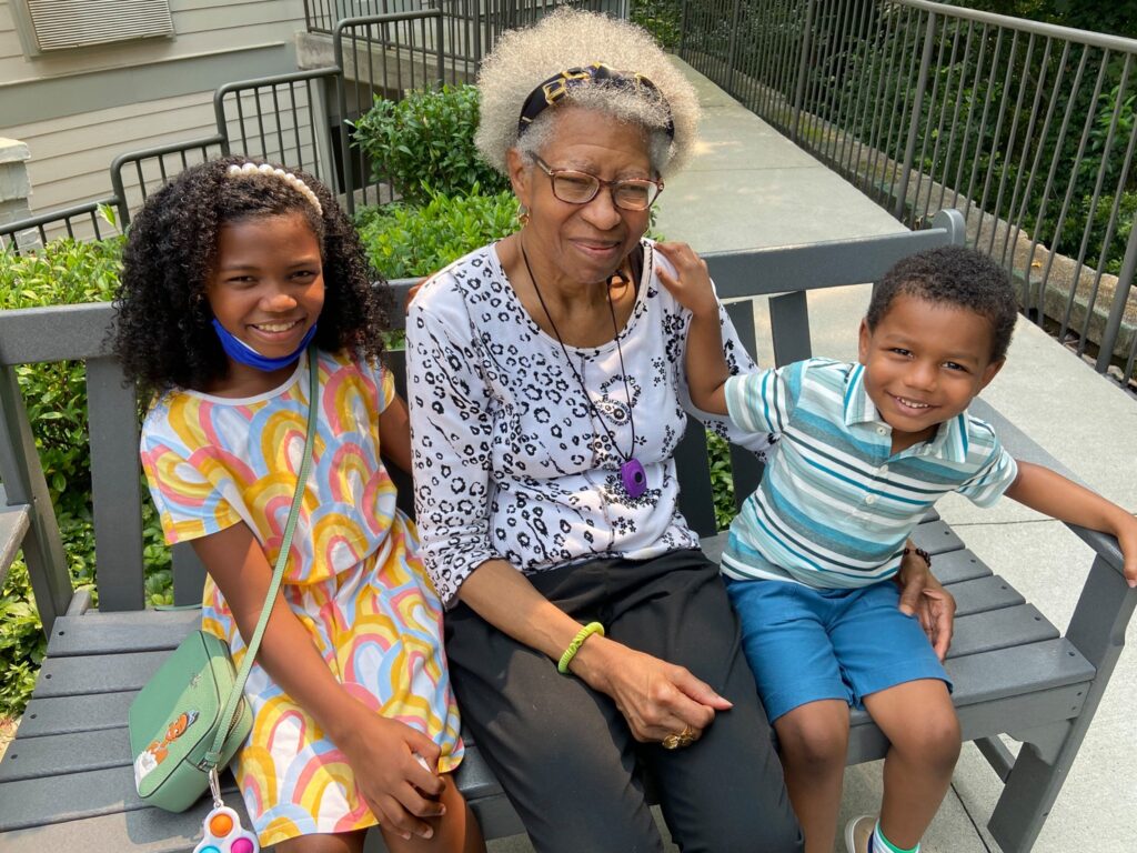 Atlas Senior Living | Resident and her grandchildren