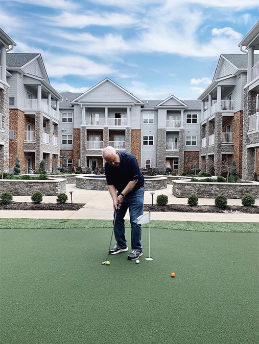 Residents using the putting green