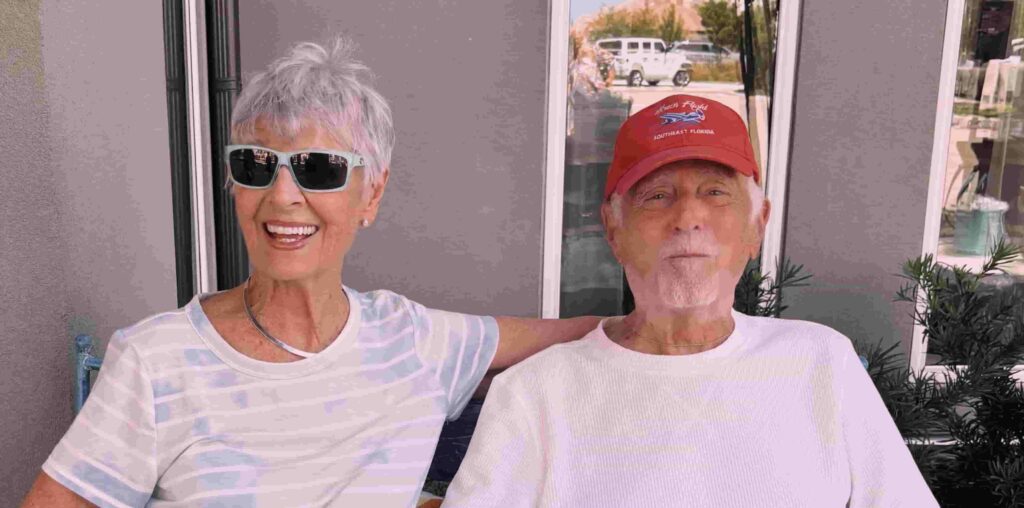 Smiling senior couple enjoying time together at The Goldton at Venice, highlighting community connection and hurricane preparedness in senior living in Venice, FL
