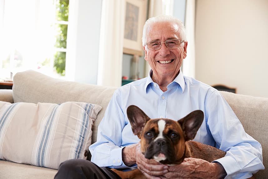 Senior with a pet in a senior living community