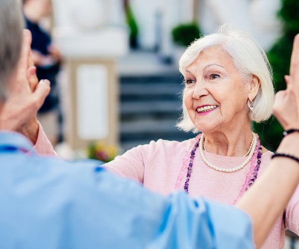 Group of beautiful and happy senior adult women dating outdoors and meeting in the city - Stylish fashionable old mature people social gathering and having fun in a cafe