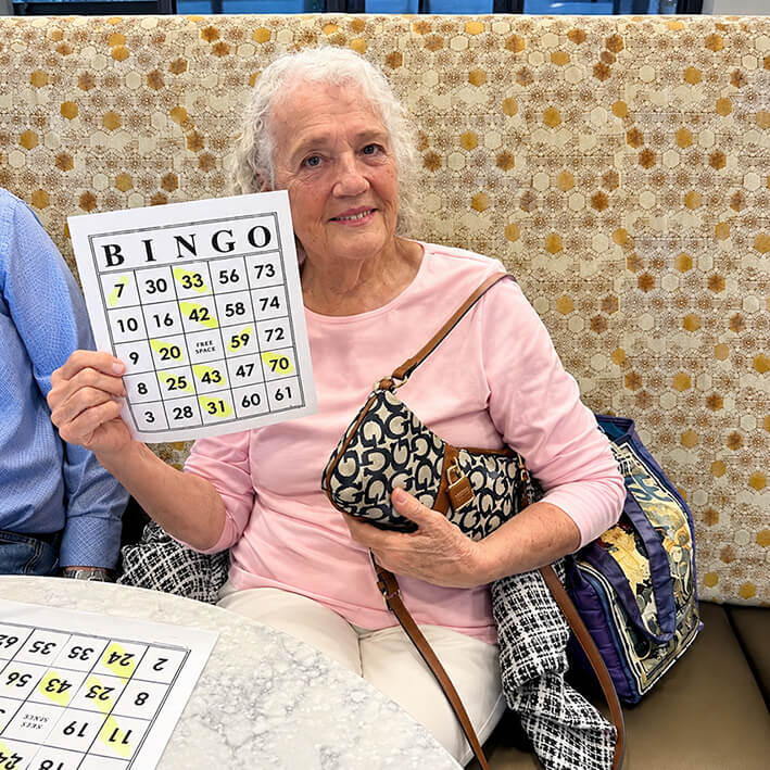 Elderly Woman Showing Bingo Card
