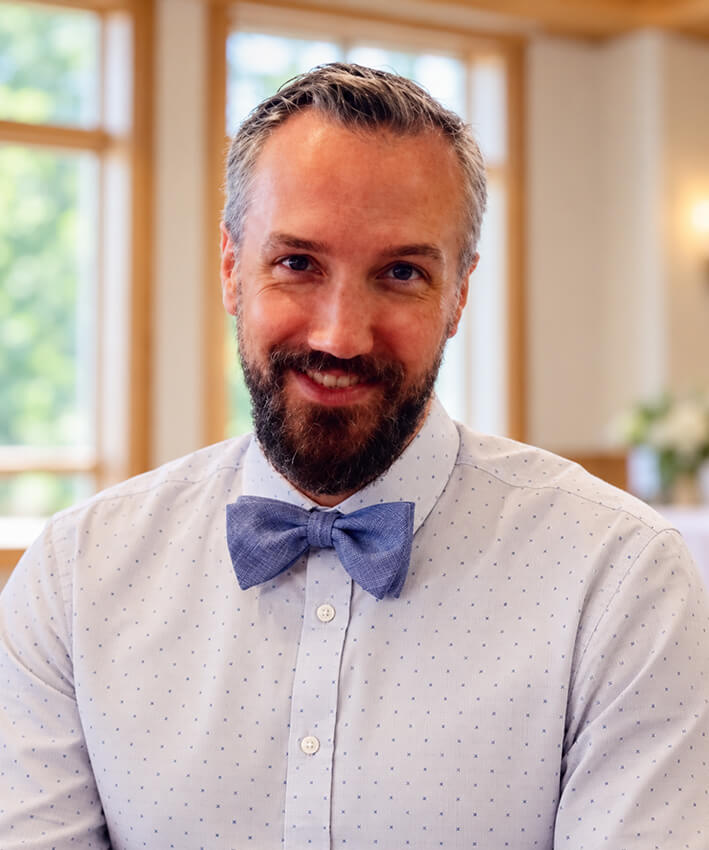 Smiling Man in Blue Bow Tie