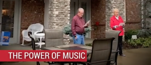 Senior residents at Legacy Reserve at Fritz Farm in Lexington, KY join together in song outside their balconies.