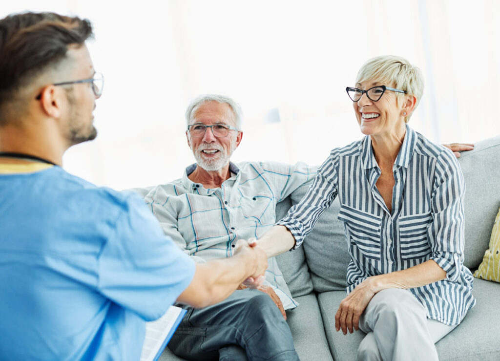 Atlas Senior Living | Senior couple meeting caregiver