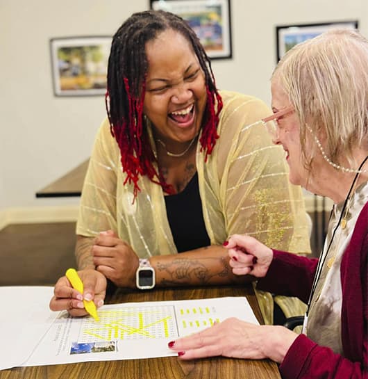 Senior with puzzle game Atlas Senior Living