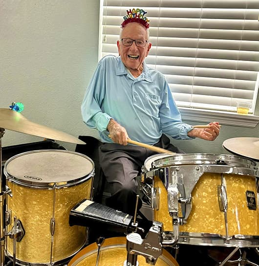 Senior Happy Playing Drums